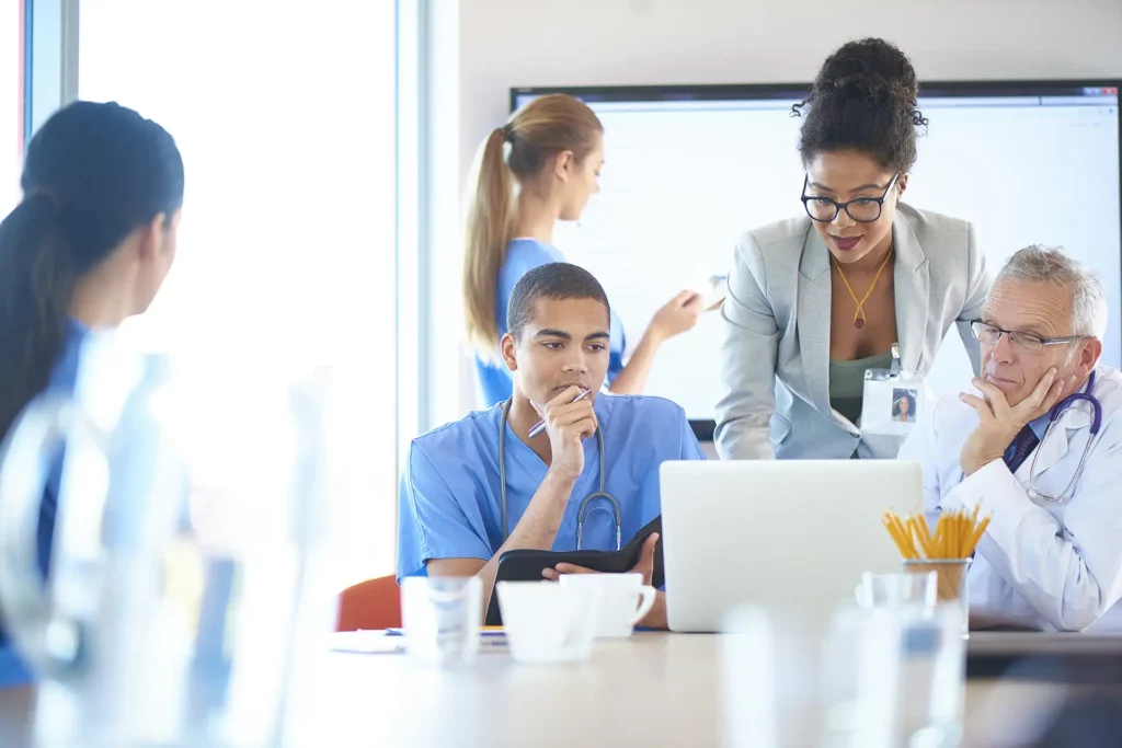 Healthcare professionals and administrators working together